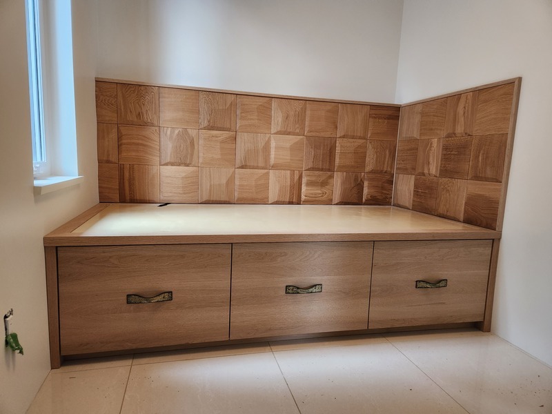 Custom-built wooden storage bench with decorative wood paneling
