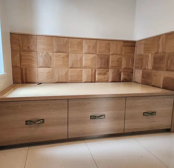 Custom-built wooden storage bench with decorative wood paneling